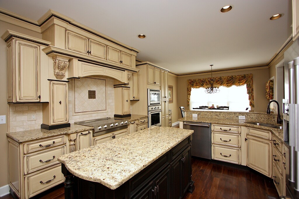 red wall antique white kitchen cabinet