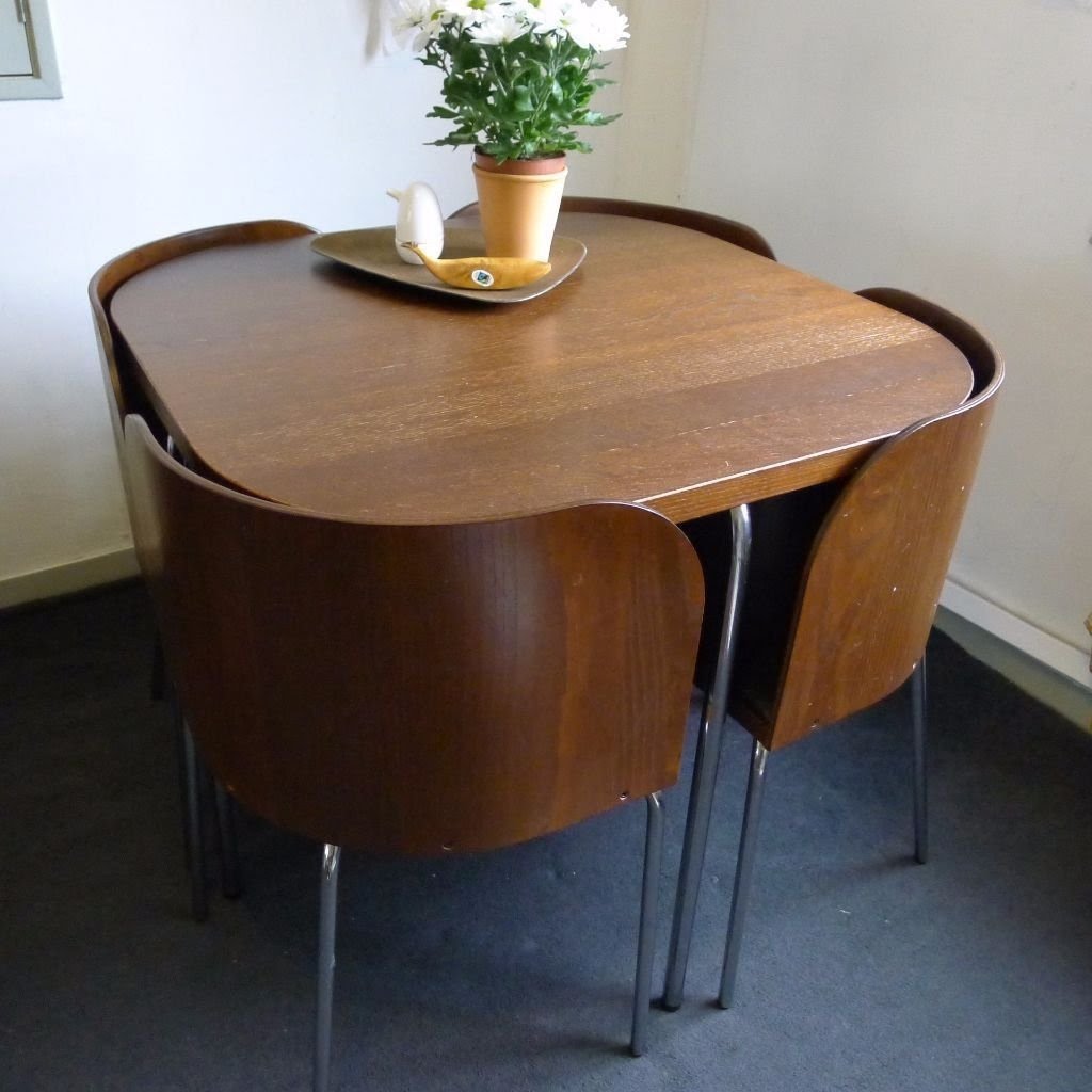 dining room table with nesting chairs