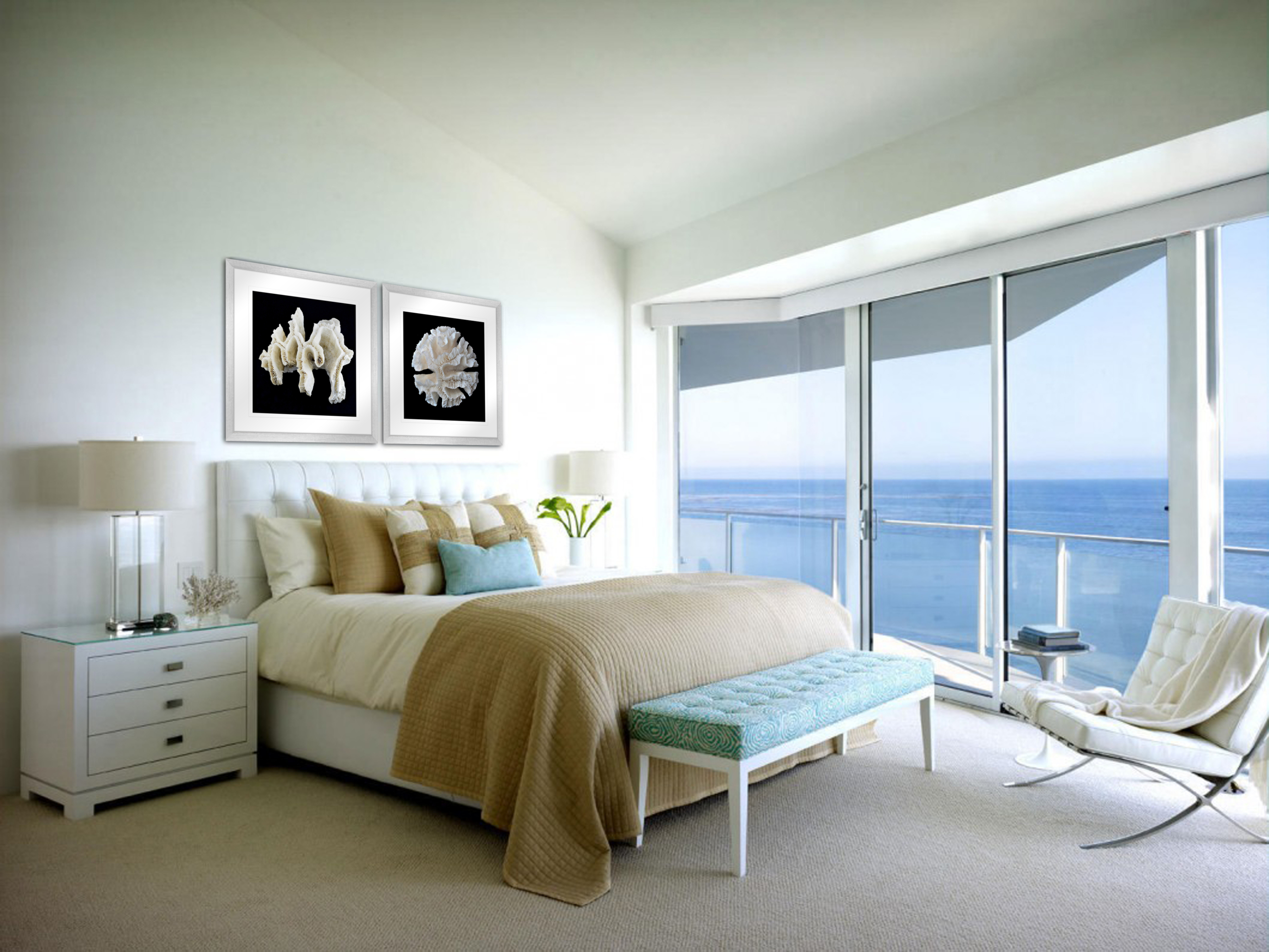 sharp white bedroom with blue seating and cream quilt