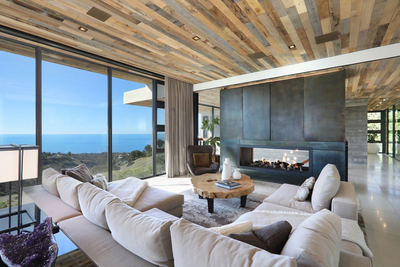 Double Sided Fireplace With Media Wall