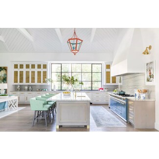 Spacious kitchen with breezy white shiplap ceiling