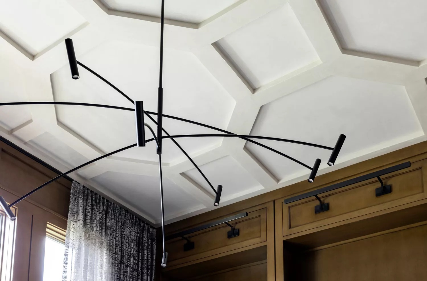 Living room with artistic honeycomb-style ceiling