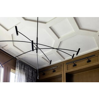 Living room with artistic honeycomb-style ceiling