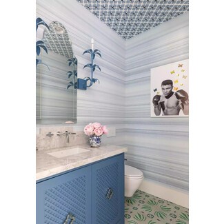 Powder bathroom with mixed patterns on ceiling and floor