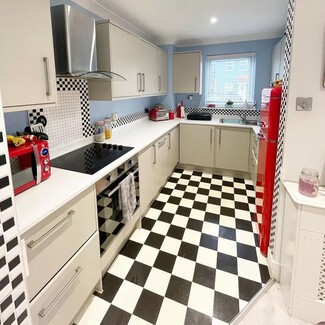 Checkered backsplash tiles in kitchen