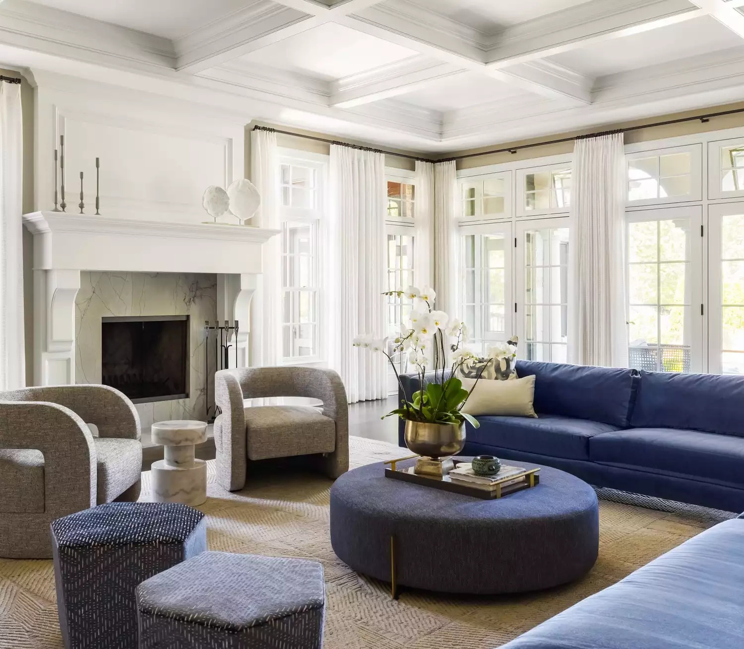 Sunlit living room with classic white tray ceiling