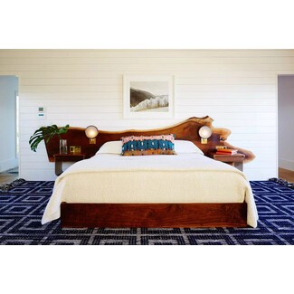 Coastal master bedroom with neutral tones and ocean view