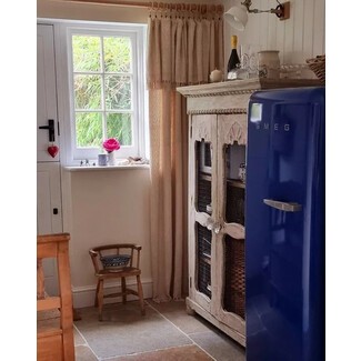 Colorful retro fridge in a bright kitchen