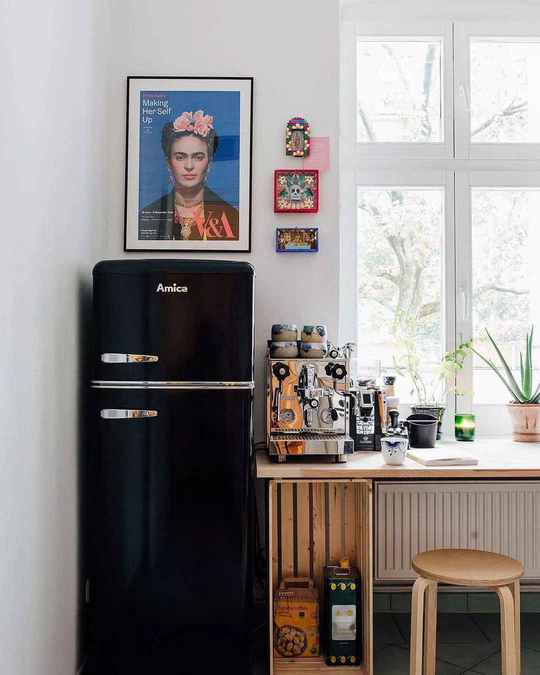 Compact fridge in dramatic kitchen space