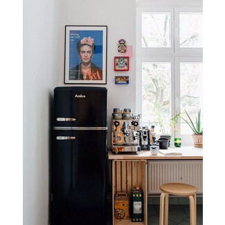 Compact fridge in dramatic kitchen space