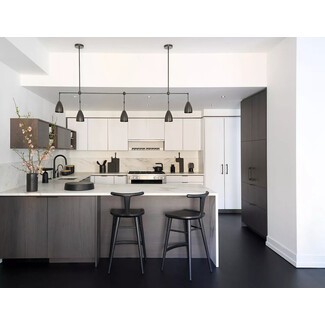 This glam black and white kitchen balances family practicality
