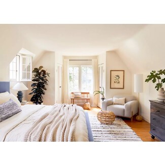 Cozy bedroom with built-in bookshelves and reading nook