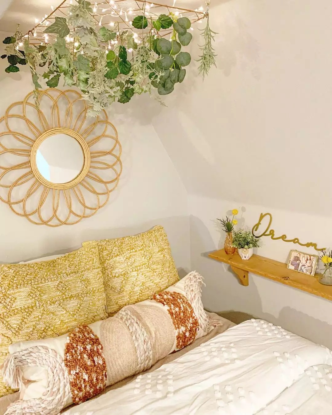 Cozy bedroom with canopy bed and fairy lights