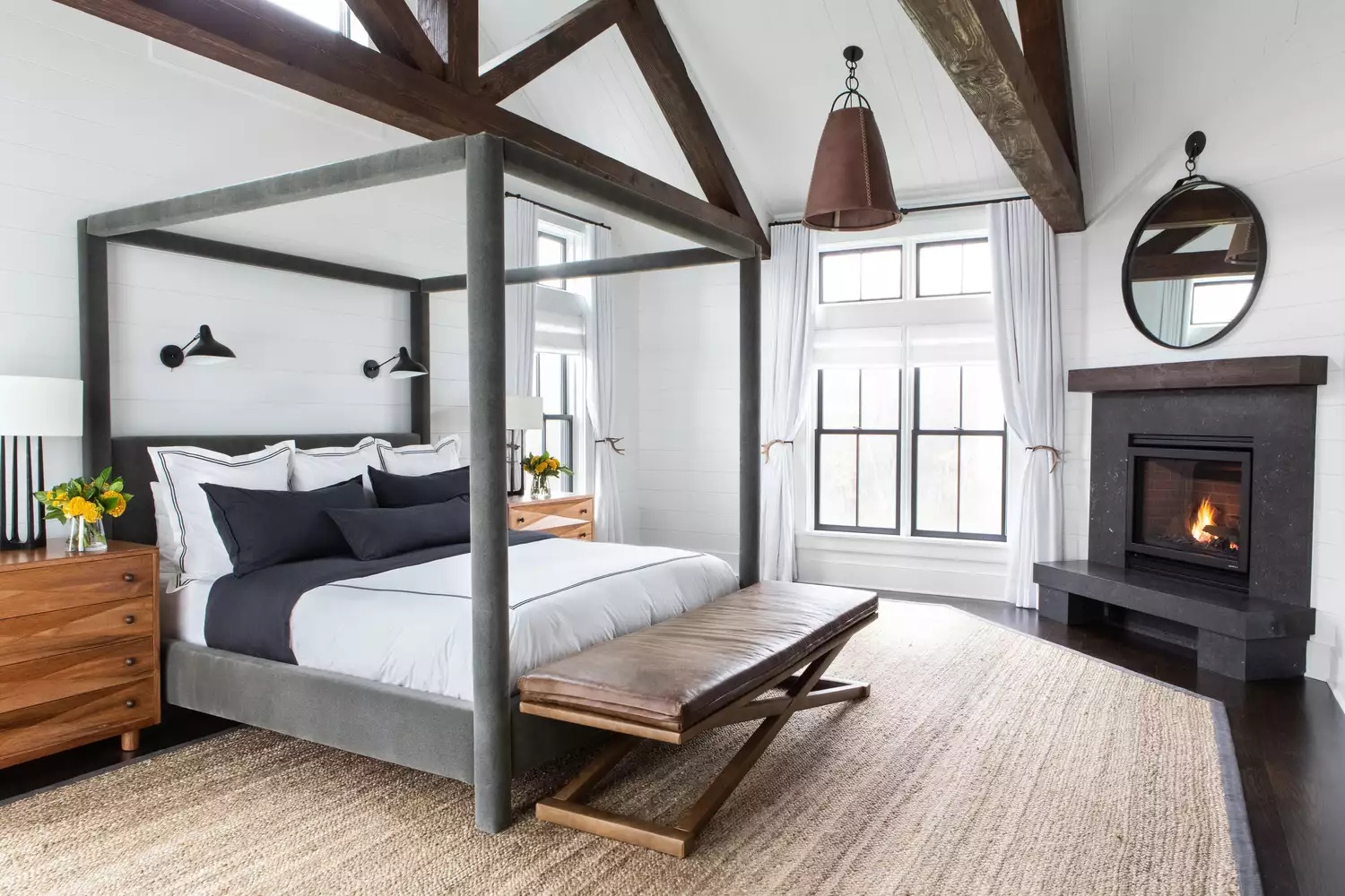Cozy farmhouse bedroom with fireplace and exposed brick