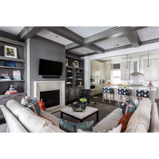 Family gathering space with cozy gray tray ceiling