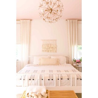 Cozy master bedroom with warm colors and textures