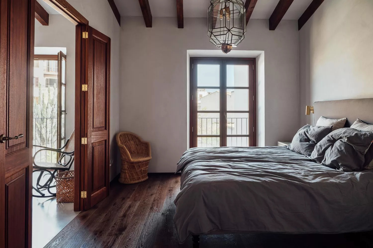 Eclectic bedroom with colorful artwork and patterned textiles