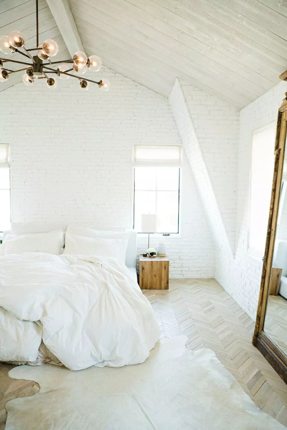 Eclectic boho bedroom with patterned textiles and plants