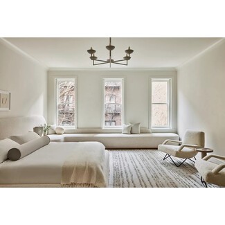 Elegant primary bedroom with fireplace and sitting area