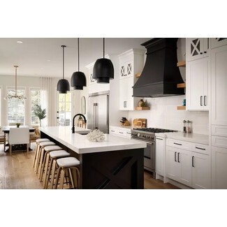 Industrial farmhouse kitchen with bold black accents and rustic elements