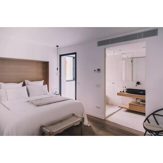 Stylish bedroom with green accents and plants