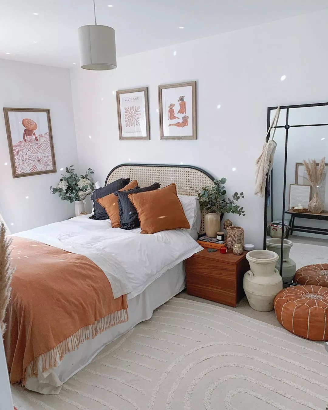 Home office with wooden desk and green plants