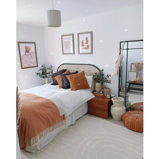 Home office with wooden desk and green plants