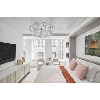 Loft-style bedroom with exposed brick and industrial elements