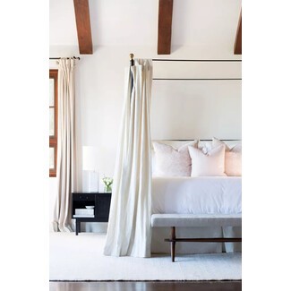 Lush bedroom with greenery and organic textures