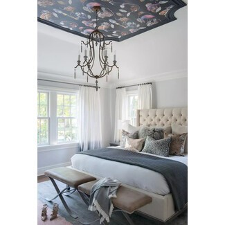 Luxurious bedroom with blue accents and traditional design elements