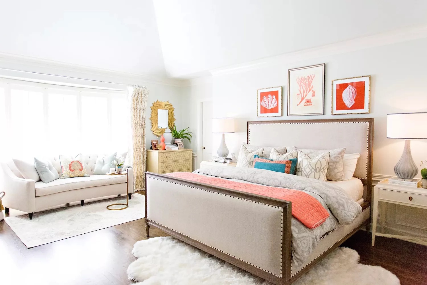 Luxurious bedroom with chandelier and tufted headboard