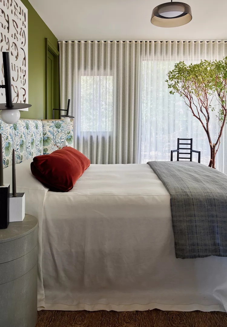 Luxurious bedroom with velvet headboard and metallic accents