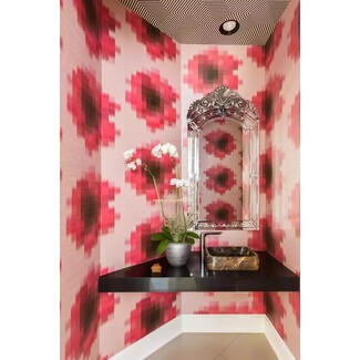 Maximalist black and white striped powder room