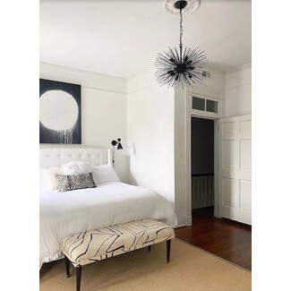 Minimalist bedroom with geometric wall art