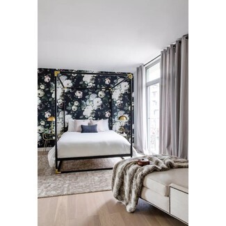 Minimalist bedroom with floor-to-ceiling windows and modern furniture