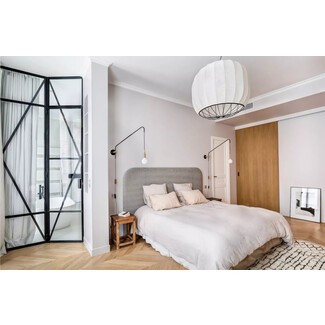 Modern bedroom with bold artwork and pops of color