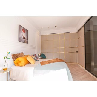 Modern bedroom with floor-to-ceiling windows and minimalist design