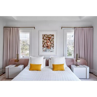 Modern master bedroom with colorful accents and white linens
