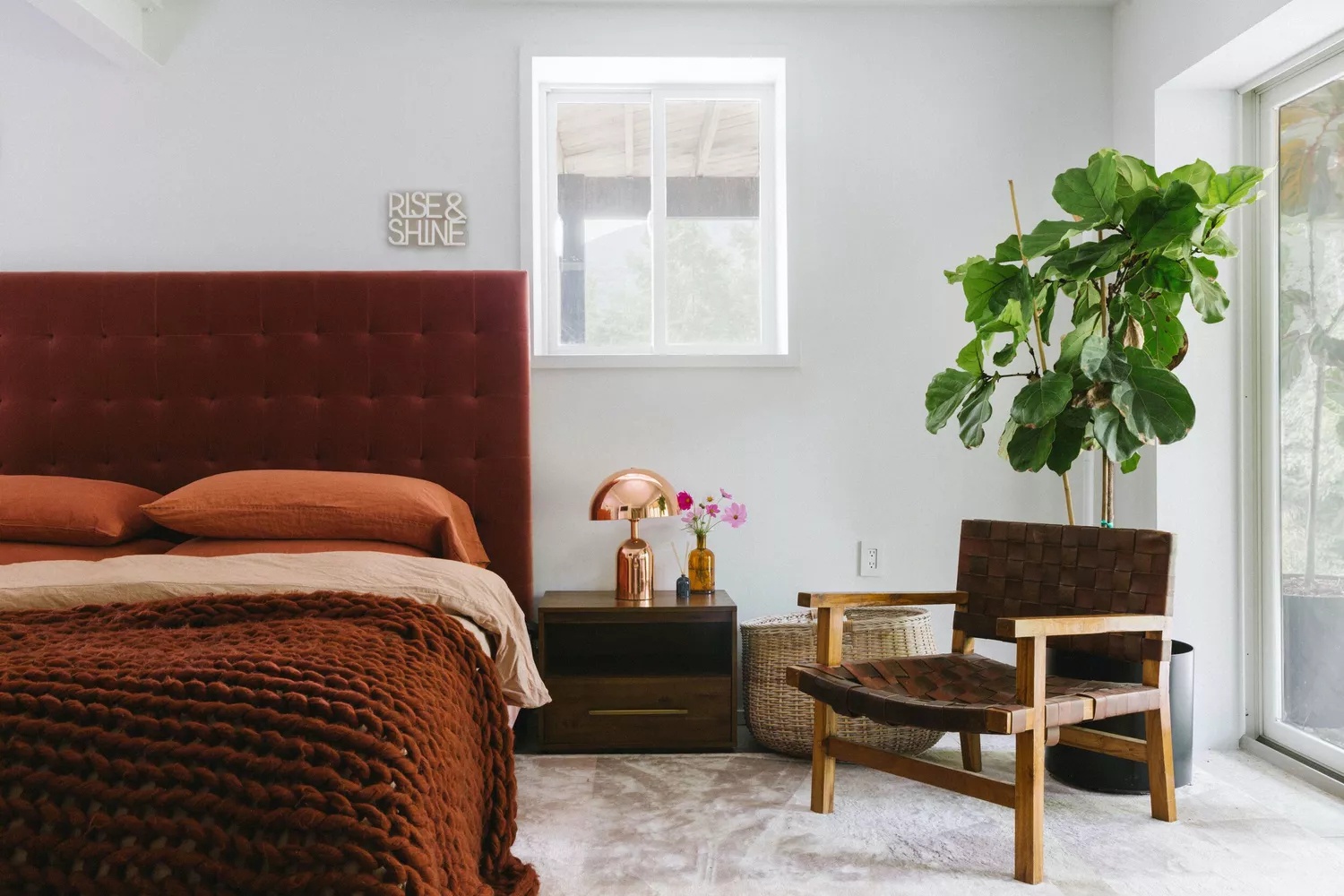 Modern farmhouse bedroom with sliding barn door and rustic touches