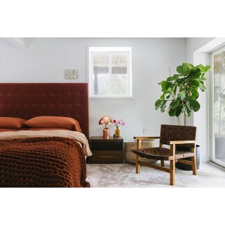 Modern farmhouse bedroom with sliding barn door and rustic touches