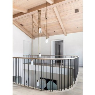 Modern home with wooden ceiling and light fixture