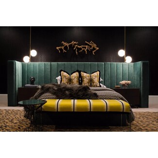 Moody guestroom with dark walls and rich textures