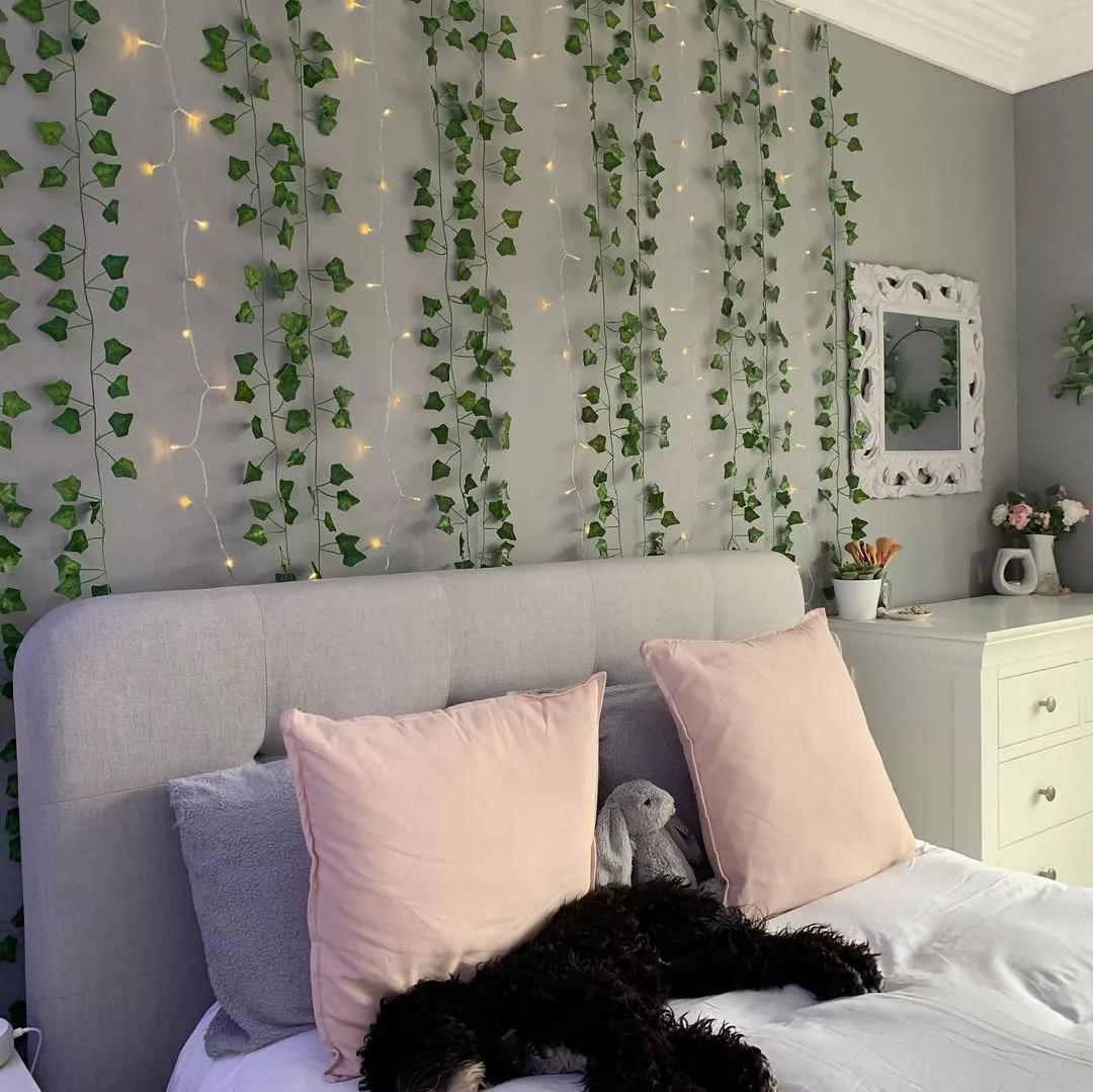 Outdoor dining area with wooden table and string lights