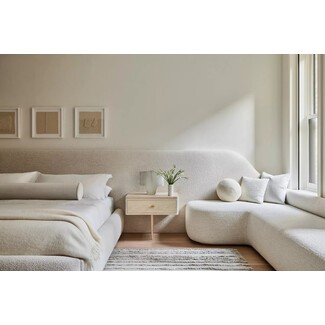 Elegant primary bedroom with nightstand detail and stylish lamps