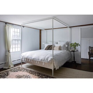 Rustic farmhouse bedroom with exposed wooden beams