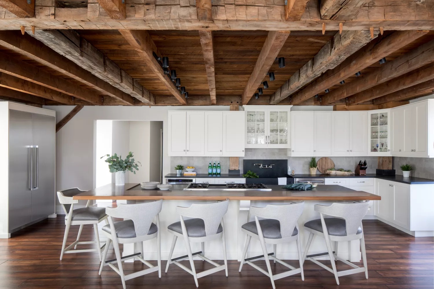 Rustic kitchen with white cabinets
