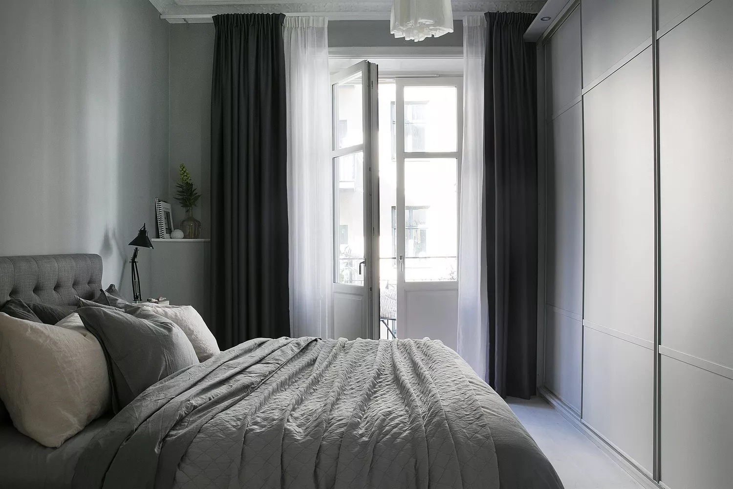 Scandinavian bedroom with neutral color palette and cozy textures