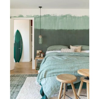 Serene master bedroom with soft color palette and modern art