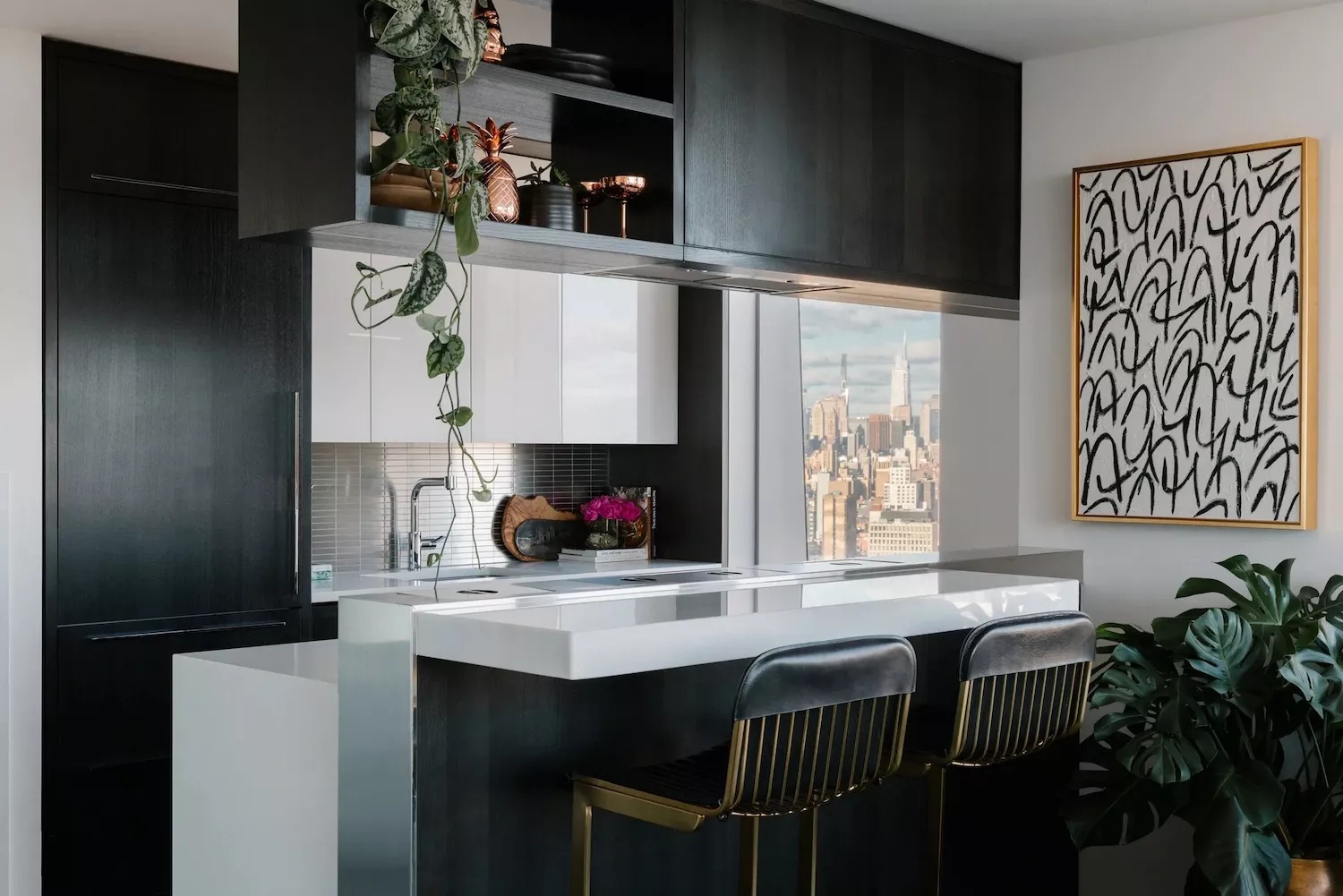 Small black and white kitchen with matte black and bright white lacquer finishes and vertical storage