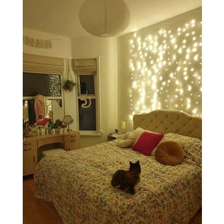 Spacious living room with large windows and white sofa